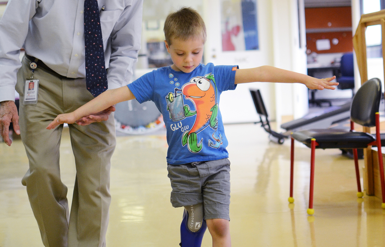 Doctor helps young boy with prosthetic leg walk at Texas Scottish Rite Hospital for Children